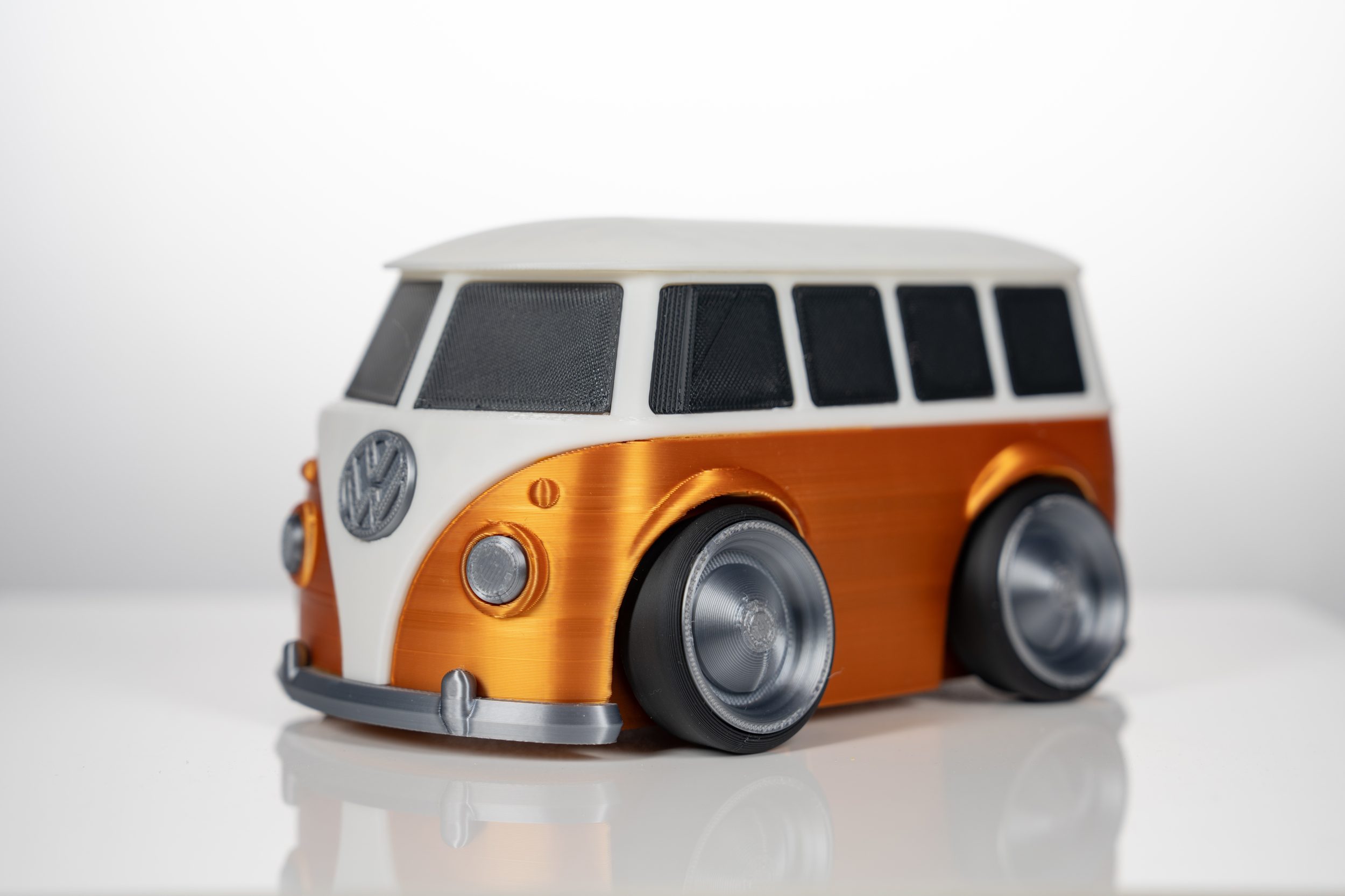 A 3D printed toon-style bus piggy bank.