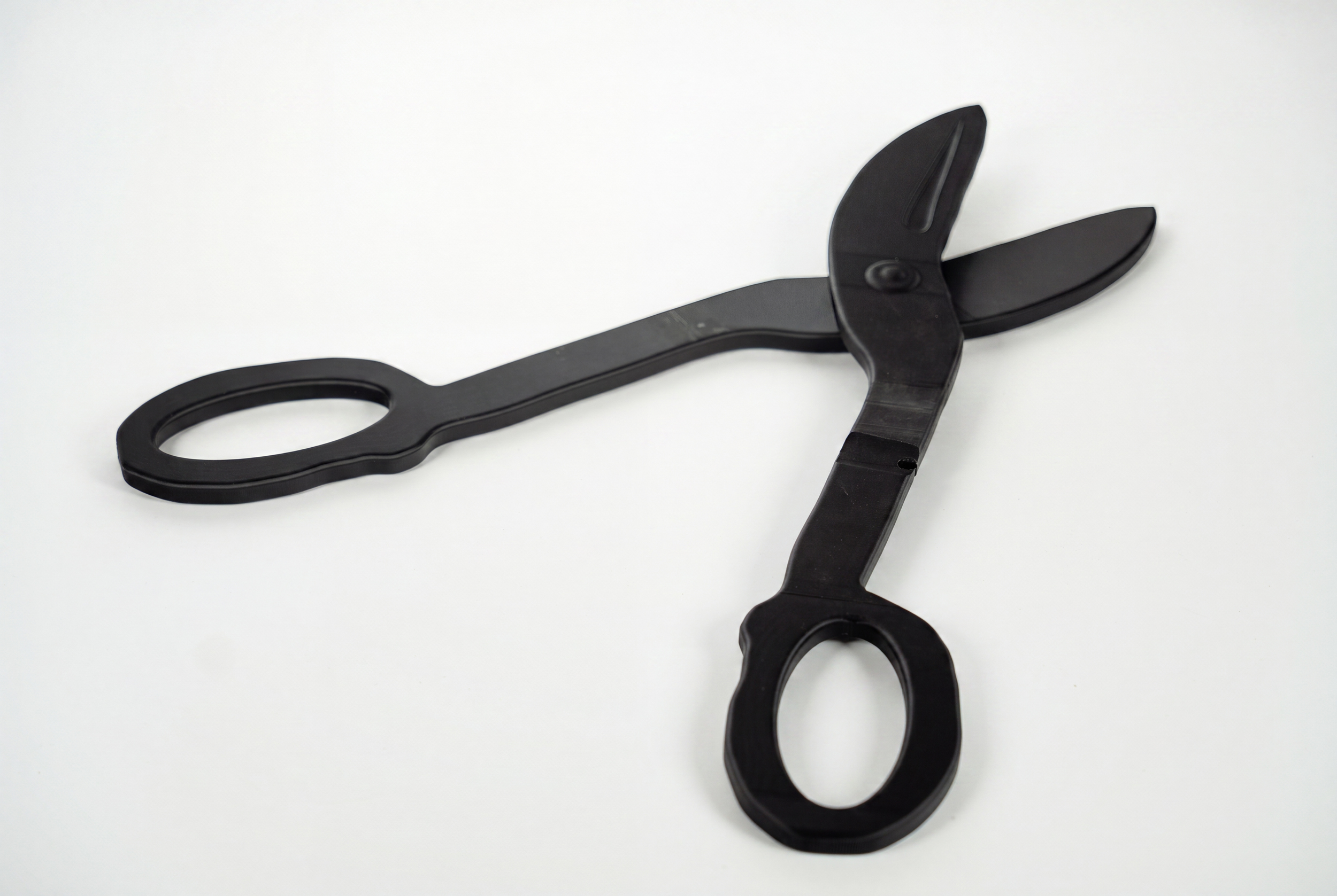 Assembled large-format 3D printed display piece in matte black PLA.