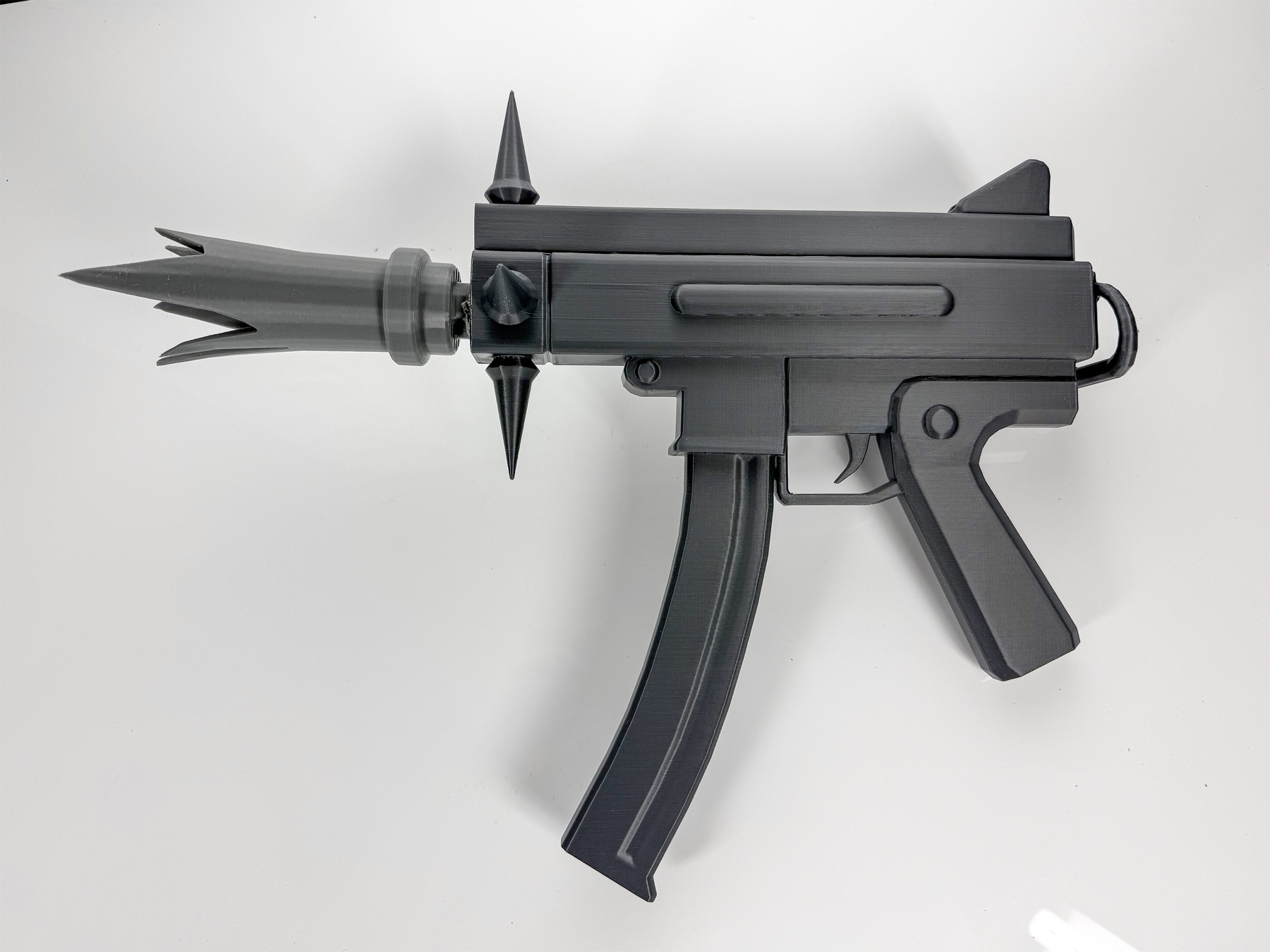 Top-down view of the complete gray 3D-printed prop on a white surface.
