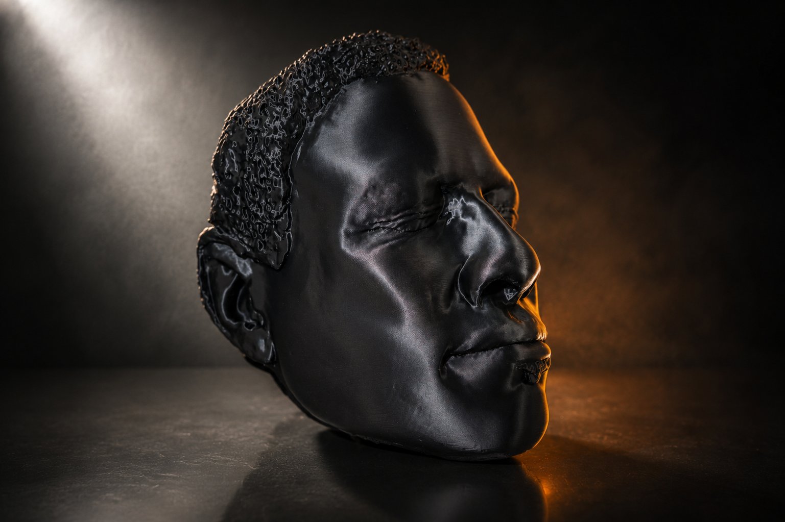 A dramatically lit 3D printed head sculpture.