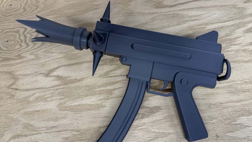 Completed gray 3D-printed Billy Deadlock cosplay prop shown from a three-quarter angle.