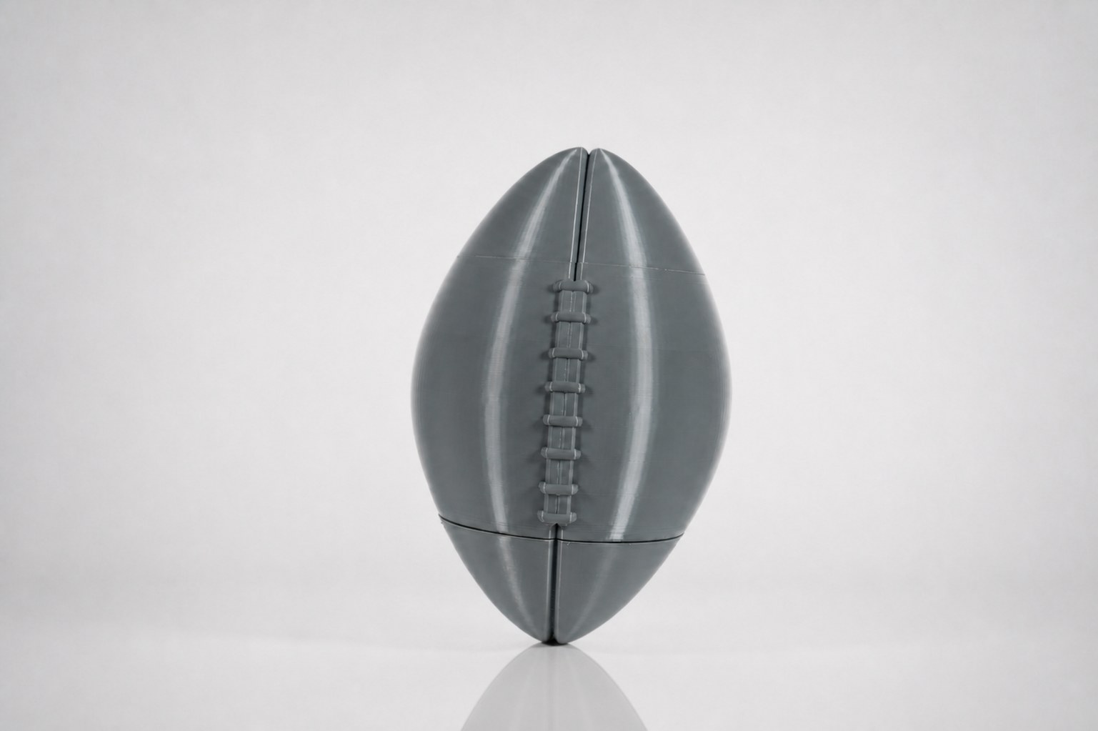 The assembled printed football with raised lacing.