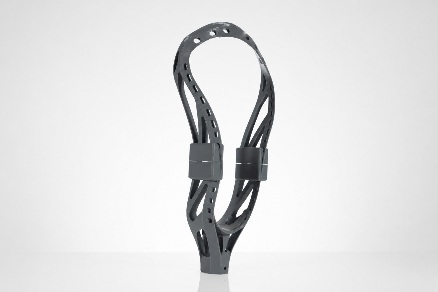 The assembled printed lacrosse head with reinforced seam cuffs.